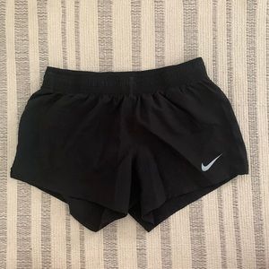 Black Nike running shorts
